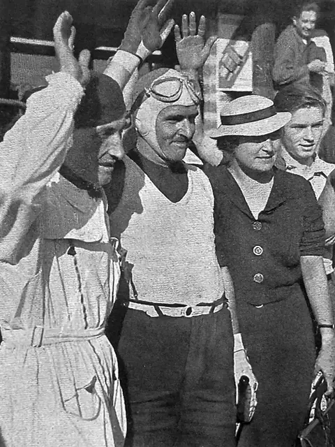 Nino Farina (centre) after winning at Brno in 1934