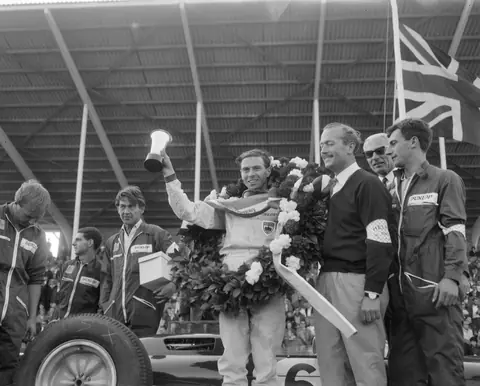 Jim Clark with the wreath after winning the 1963 Dutch Grand Prix at Zandvoort, one of the 18 British wins in a row.